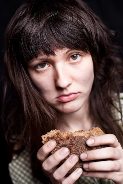 Beggar with a piece of bread — Stock Photo, Image