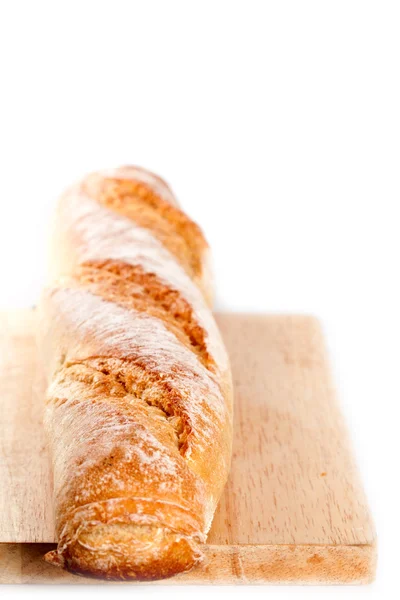 Stokbrood op de houten bord — Stockfoto