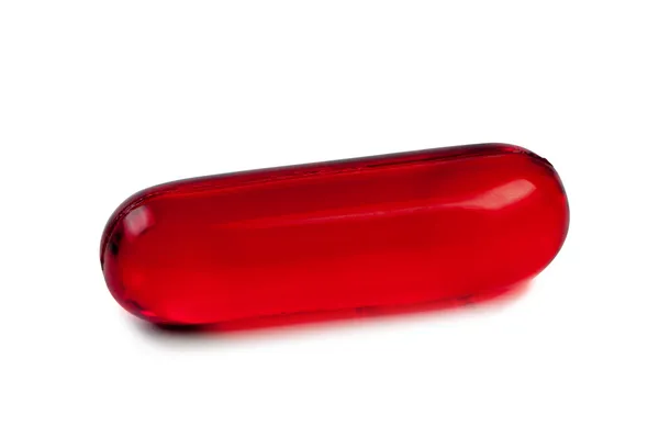 Comprimido vermelho close-up isolado . — Fotografia de Stock