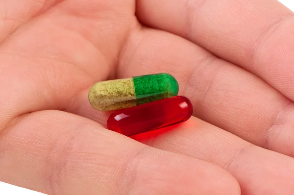 Las píldoras en la palma se acercan . — Foto de Stock