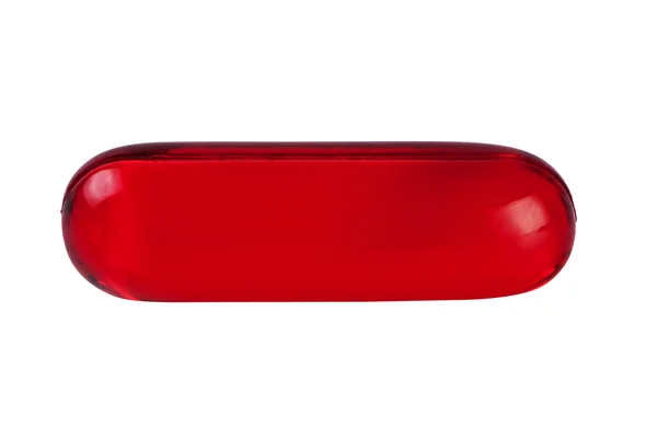 Comprimido vermelho close-up isolado em branco . — Fotografia de Stock