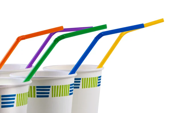 Eldobható poharak színes csövek. — Stock Fotó