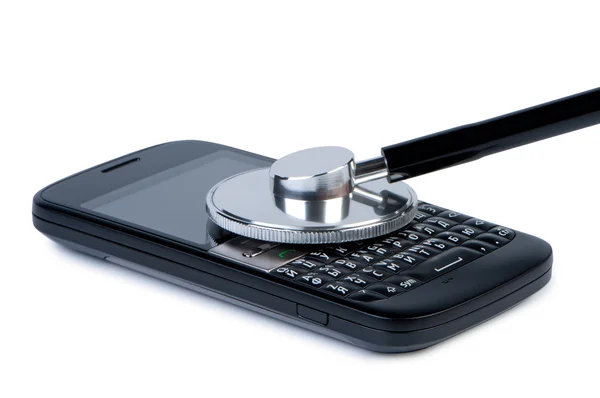 Мобильный телефон со стетоскопом, концепция диагностики и обслуживания . — стоковое фото
