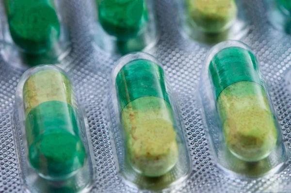 Pills in packing close up. Macro photo. — Stock Photo, Image