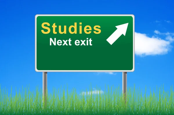 Studies road sign on sky background, grass underneath. — Stock Photo, Image