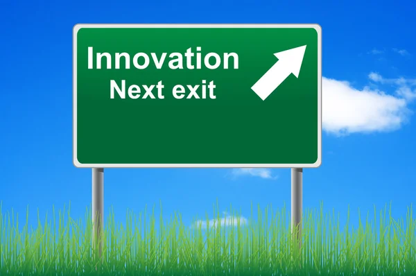 Innovation road sign on sky background, grass underneath. — Stock Photo, Image