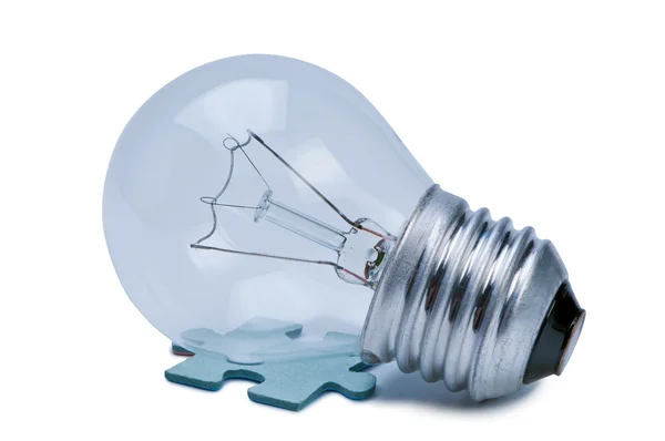 Bulb and puzzle isolate on white background. — Stock Photo, Image
