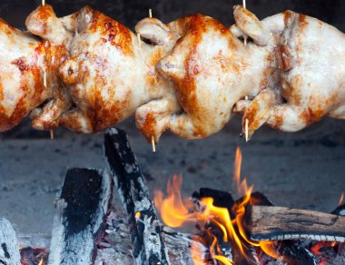 Chicken-grilled prepared over an open fire. clipart