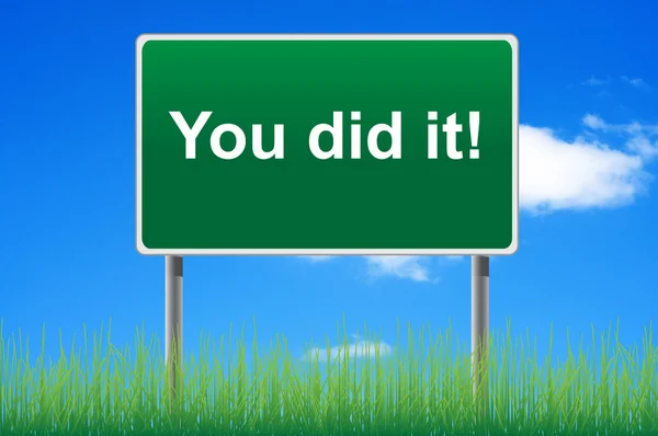 You did it road sign on sky background. Bottom grass. — Stok fotoğraf