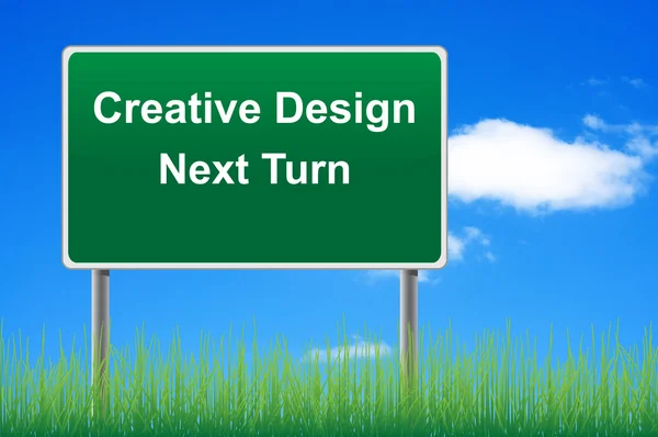 Creative design signpost on sky background, grass underneath. — Stock Photo, Image
