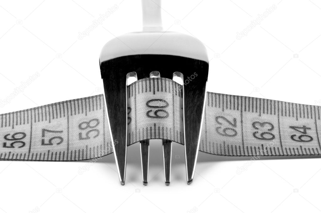 Fork with ruler. Concept nutrition and diet.