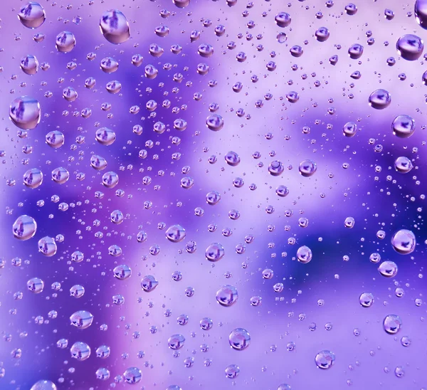 Abstracte waterdruppels doorschijnend achtergrond, macro weergave — Stockfoto