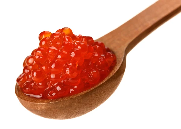 Red salmon caviar heap in wooden spoon — Stock Photo, Image