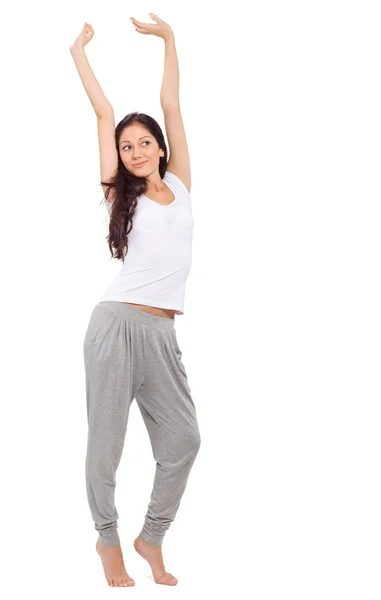 Young beautiful brunette girl stretching after awaking — Stock Photo, Image