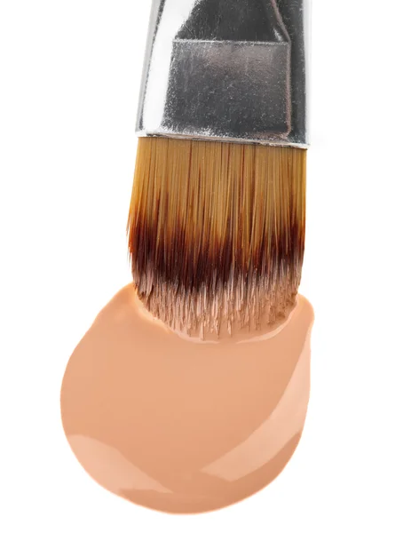 Beige liquid foundation makeup stroke with brush, isolated on wh — Stock Photo, Image