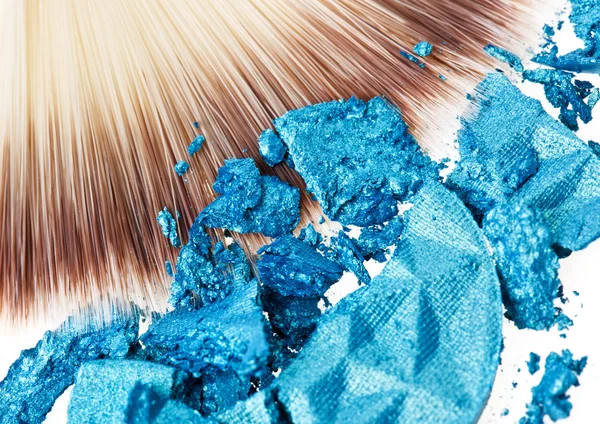 Makeup wide brush with blue crushed eye shadow — Stock Photo, Image