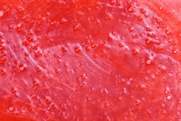 Red shower gel sample, background texture — Stock Photo, Image