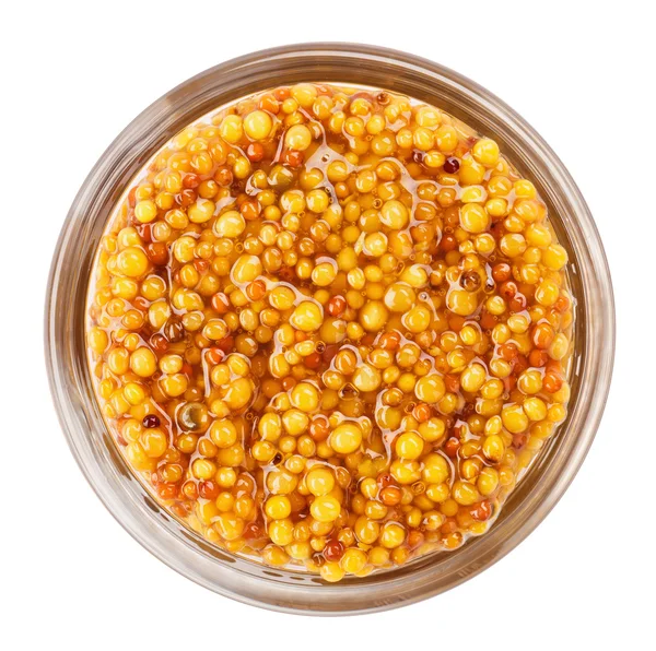 Grain mustard in transparent glass bowl, isolated on white — Stock Photo, Image