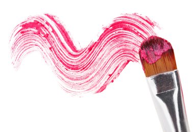 Pink lipstick stroke (sample) with makeup brush, isolated on whi clipart