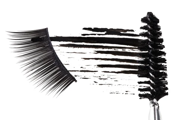Traço de rímel preto, pincel e pestanas falsas compositor abstrato — Fotografia de Stock