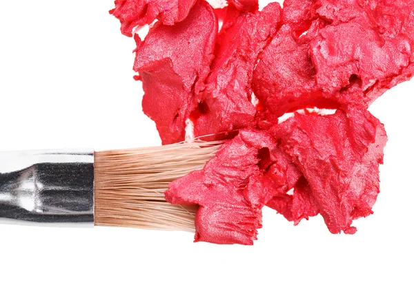 Red lipstick stroke (sample) with makeup brush, isolated on whit — Stock Photo, Image