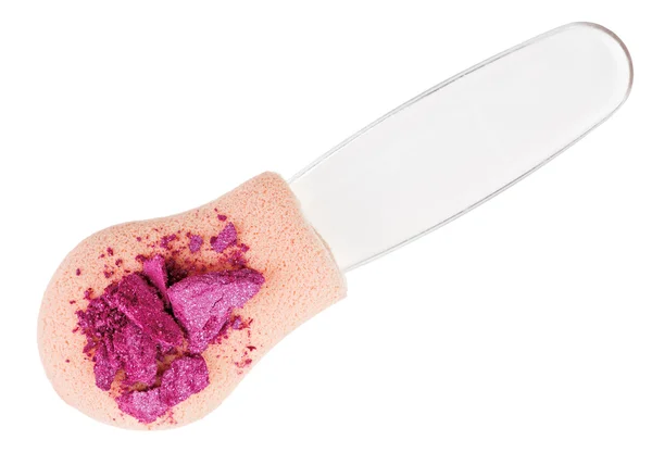 Heap of broken pink eyeshadow over makeup sponge, isolated on wh — Stock Photo, Image