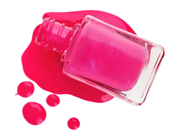 Бутылка розового лака для ногтей с образцами капель эмали, выделенных на — стоковое фото