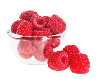 Red ripe raspberry fruit in transparent glass, isolated on white clipart