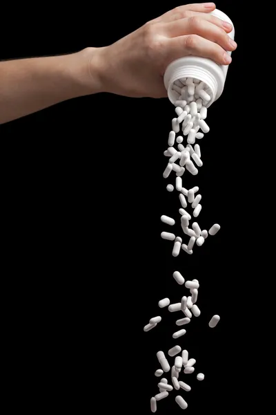 Spilling vitamin pills — Stock Photo, Image