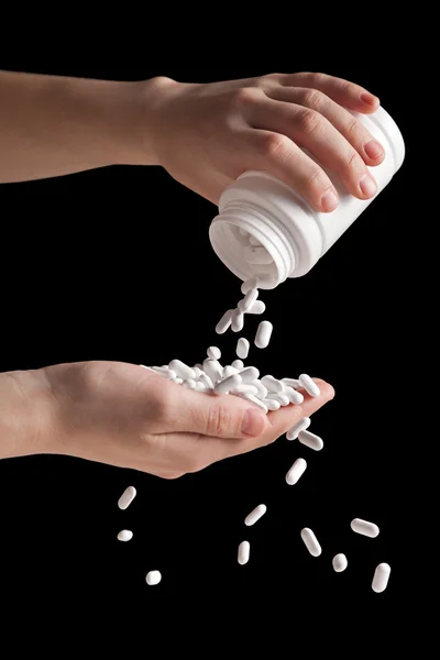 Spilling vitamin pills — Stock Photo, Image