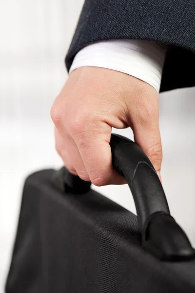 Hand holding briefcase — Stock Photo, Image