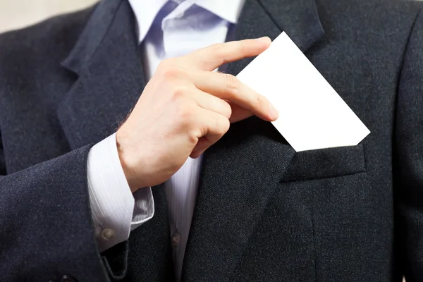 Üres kártya a kezében üzletemberek — Stock Fotó
