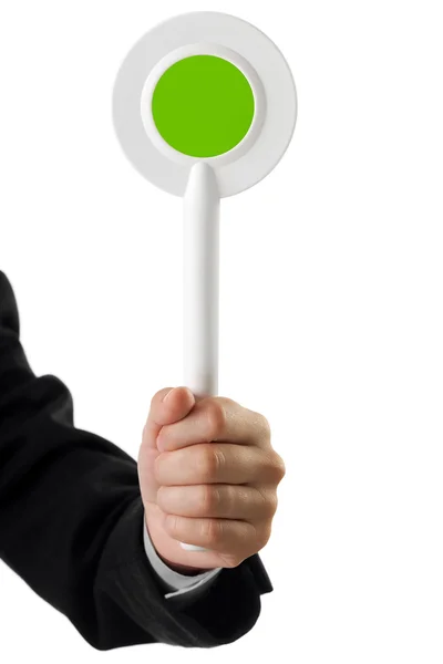 Auction paddle or voting card in hand — Stock Photo, Image