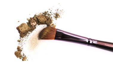 Cosmetic brush and crushed mixed color eyeshadow clipart