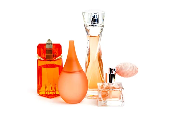Pomarańczowy perfum butelek na białym tle Obrazy Stockowe bez tantiem