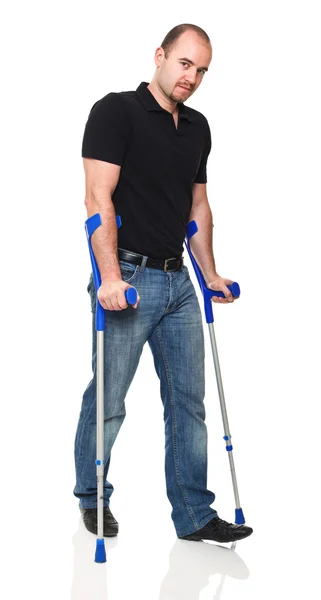 Man with crutch — Stock Photo, Image
