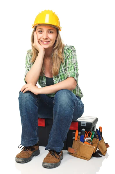 Woman on toolbox — Stock Photo, Image