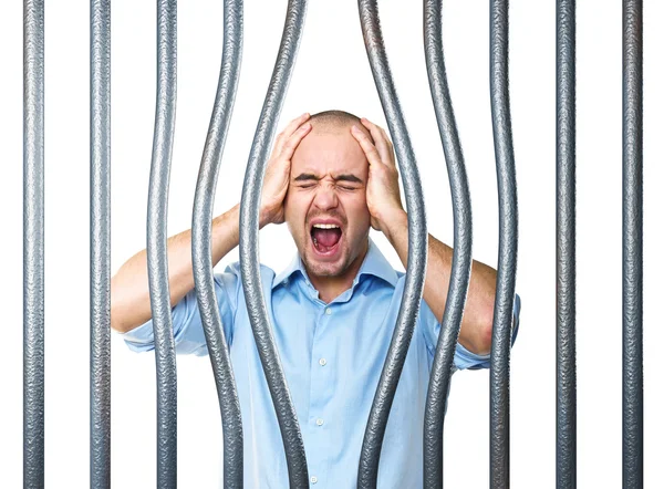 Напряженный заключенный и изогнутый металлический стержень — стоковое фото