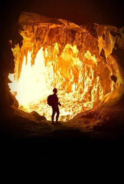 Woman in cave — Stock Photo, Image