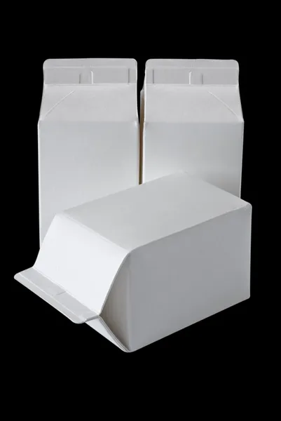 Tři krabice mléka na půl litr na černém pozadí — Stock fotografie