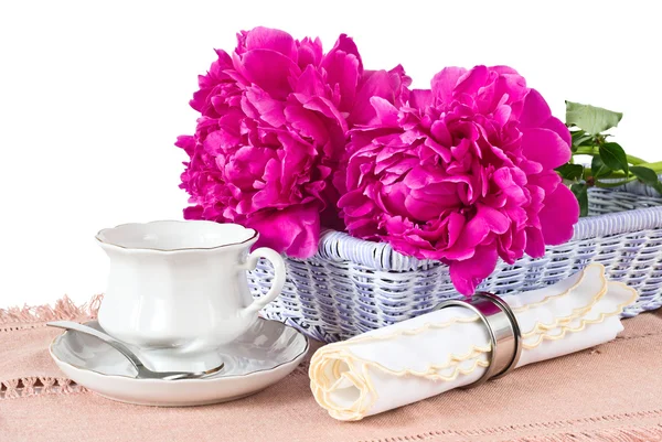 Cup, napkin and peonies — Stock Photo, Image