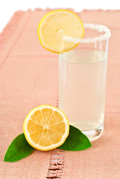 Glass of lemonade and lemon — Stock Photo, Image
