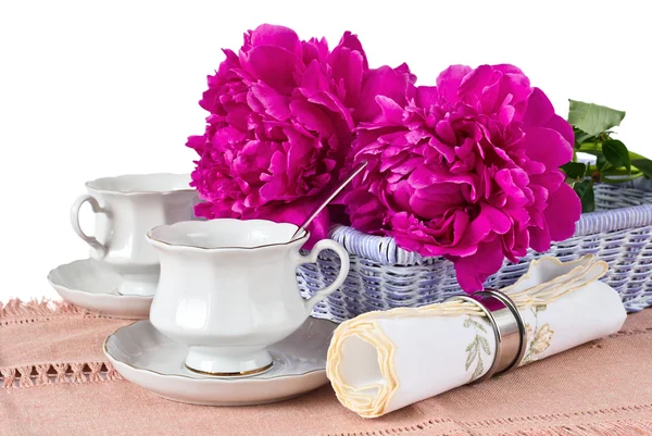 Cup, napkin and peonies — Stock Photo, Image