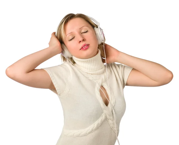 Een jong meisje luistert naar muziek op hoofdtelefoon Stockfoto