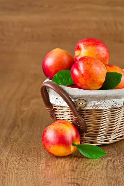 Juicy nectarines in the basket — Stock Photo, Image