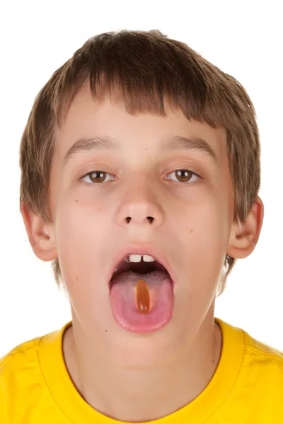Rapaz a tomar um comprimido — Fotografia de Stock