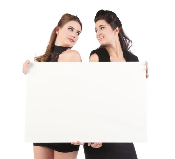 Beautiful young women with sign — Stock Photo, Image