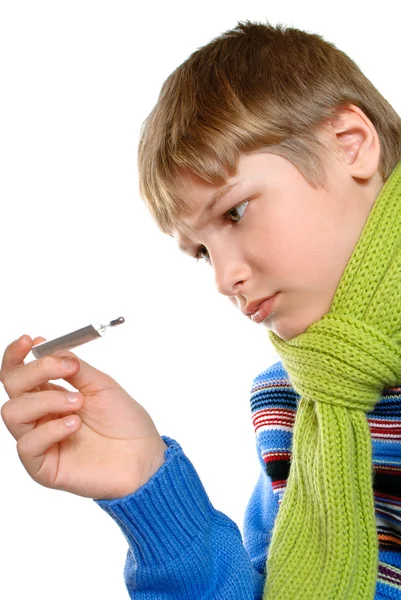 Adolescent temperature. The boy took it for its thermometer. — Stock Photo, Image