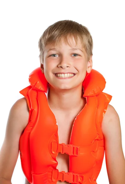 Teen in an orange life jacket for water sports - on a white back — Stock Photo, Image