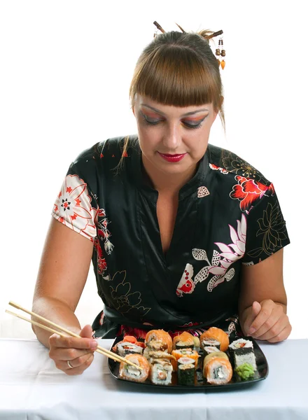 Woman eating rolls — Stock Photo, Image